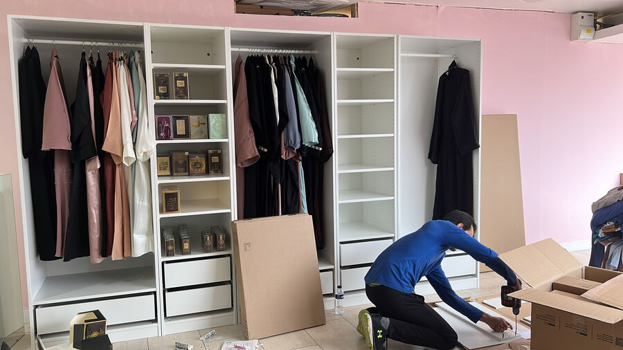 Inside the SUMAYAH shop with abayas on display